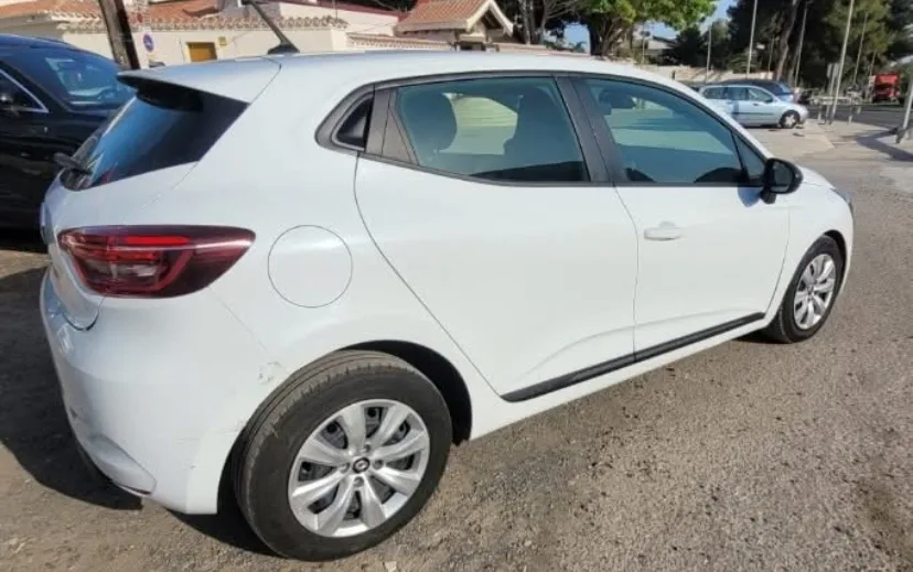 A white Renault Clio parked on a sunny street in Marbella, showcasing its modern hatchback design, clean body lines, and practical compact size. The well-maintained exterior makes it an ideal option for travelers looking to rent a Renault Clio in Marbella, offering reliability, fuel efficiency, and comfort for exploring the Costa del Sol. The bright surroundings reinforce the convenience and value of choosing this popular model when searching to rent a car in Marbella.